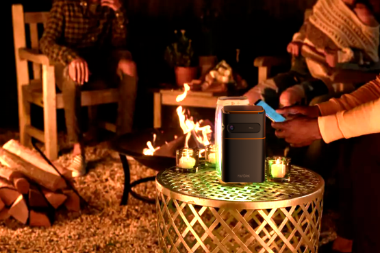 Let The Smart Mini Projector Create a Cozy Outdoor Movie Night for You